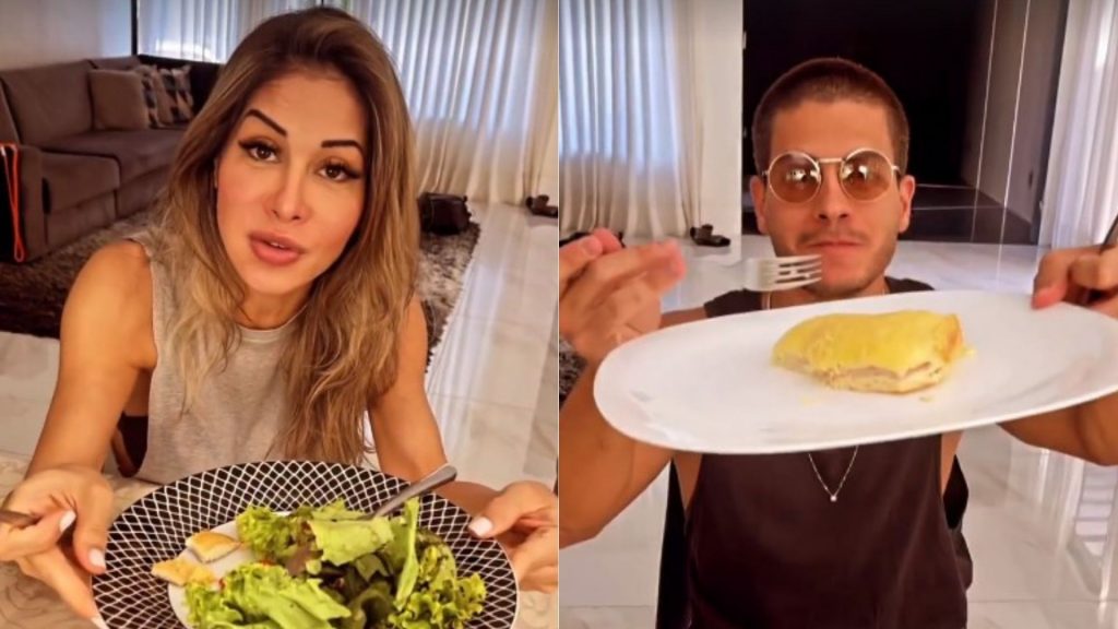 Maíra Cardi comendo salada e Arthur Aguiar segue comendo pão